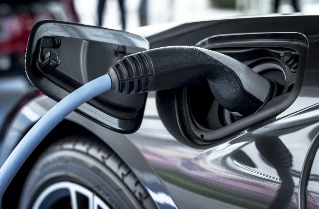 Charging connector plugged into the charge port of an electric vehicle