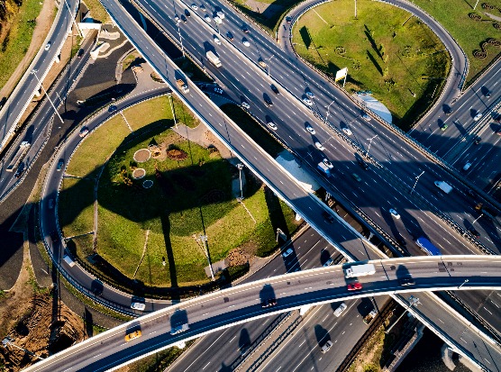 Aerial view of a multi-level highway interchange with curving ramps
