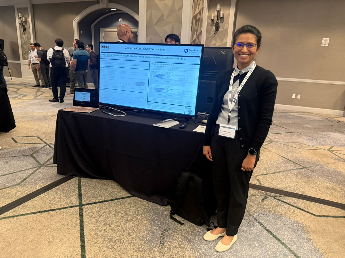 Researcher standing beside her American Control Conference 2025 poster on lithium-ion battery charging control