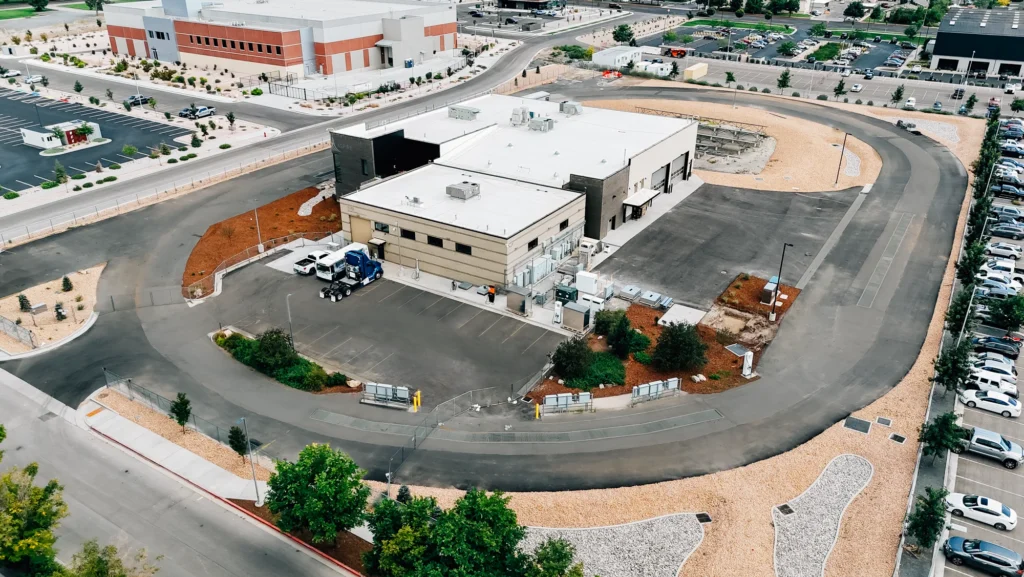 Aerial view of the EVR Electric Vehicle and Roadway building encircled by a test track and parking